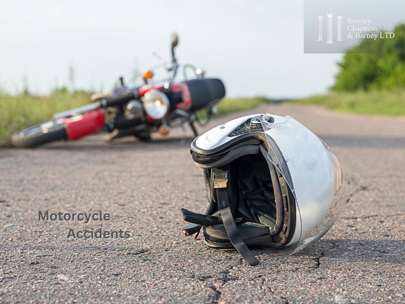 motorcycle accident and helmet on ground